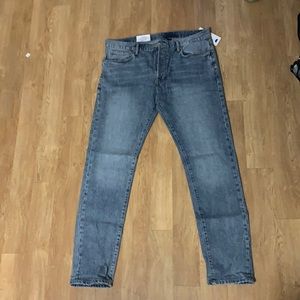 Denim washed blue jeans.